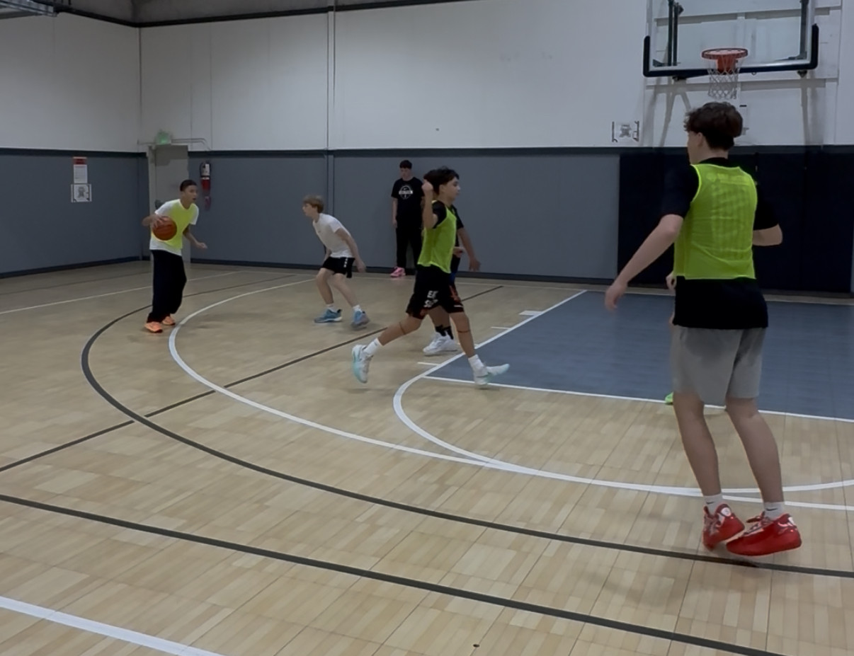 Players running a 3v3 game on the Liberty Hill Athletics court