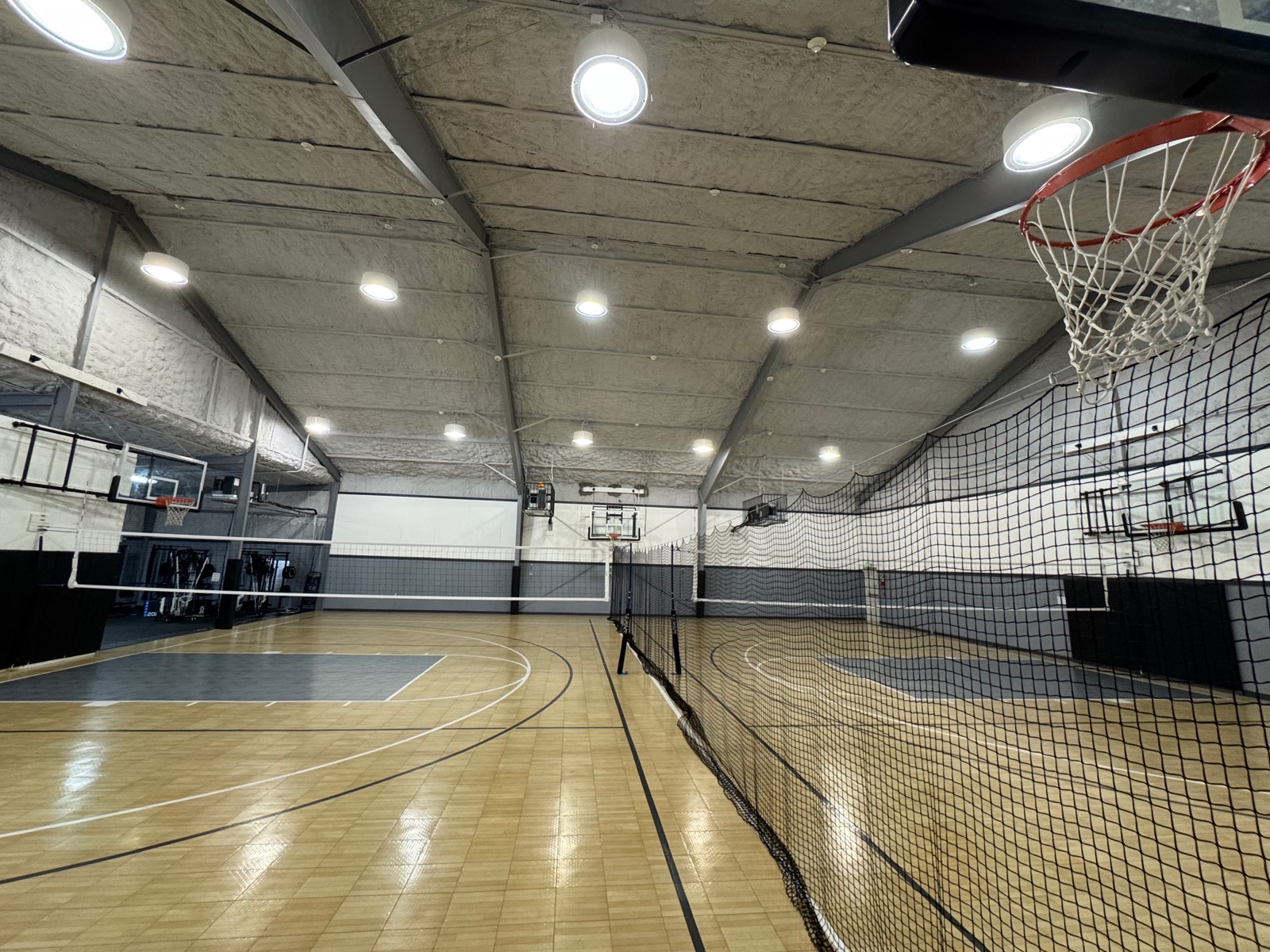 Court-level view of the volleyball nets with the divider visible behind